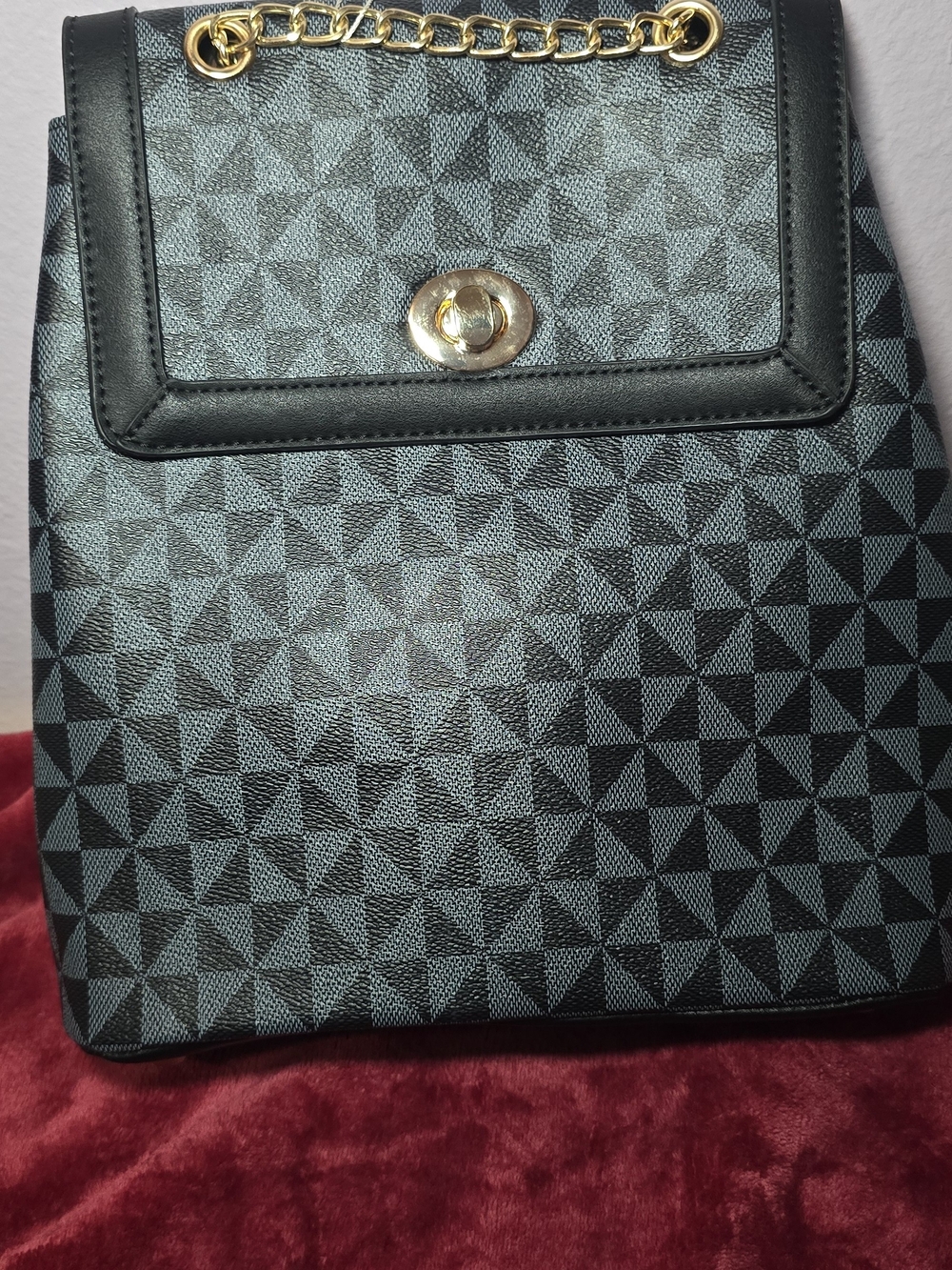 Elegant Geometric Black Backpack with Gold Hardware